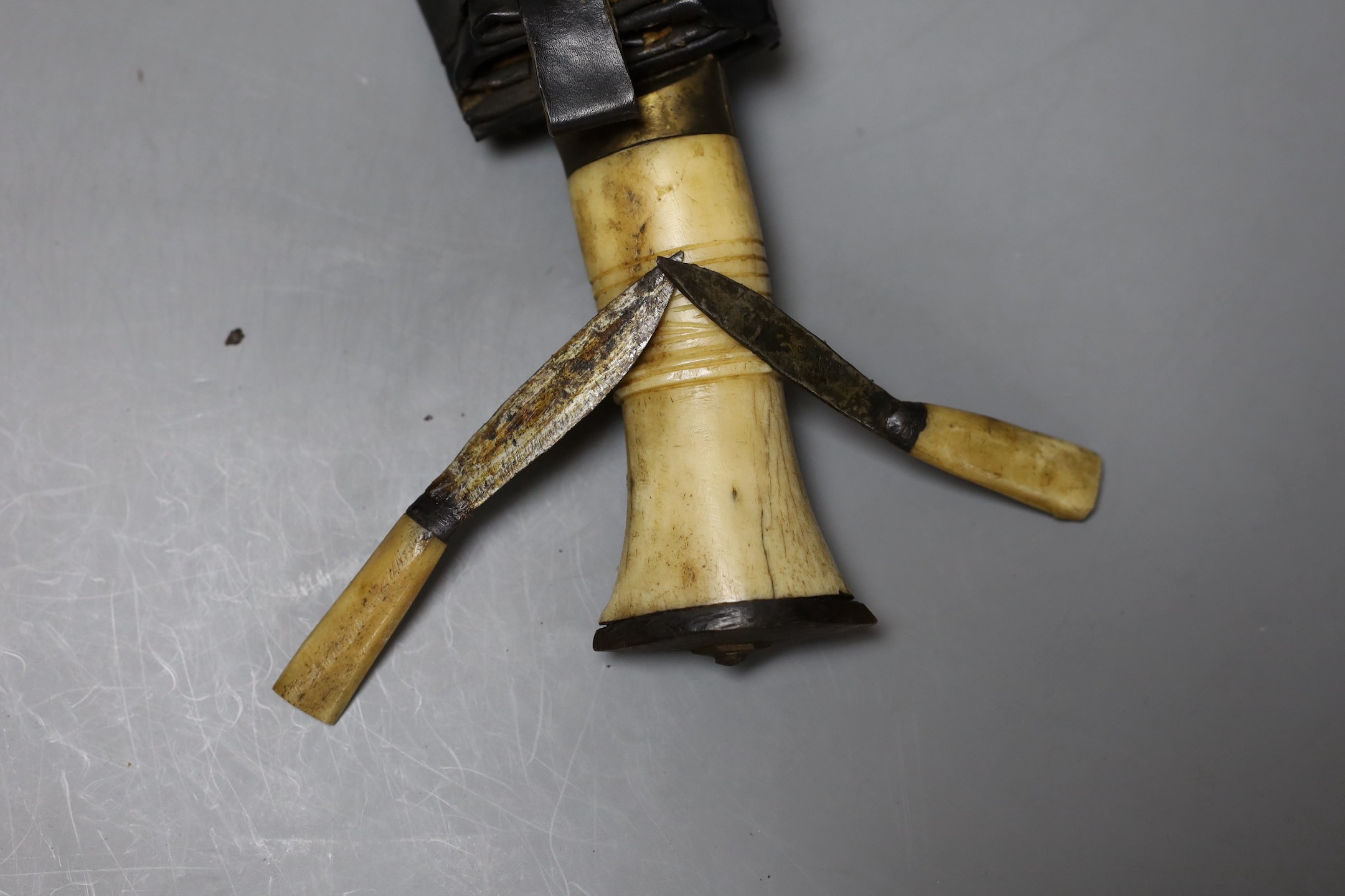 A bone handled Kukri, in paste mounted sheath, 49cm total